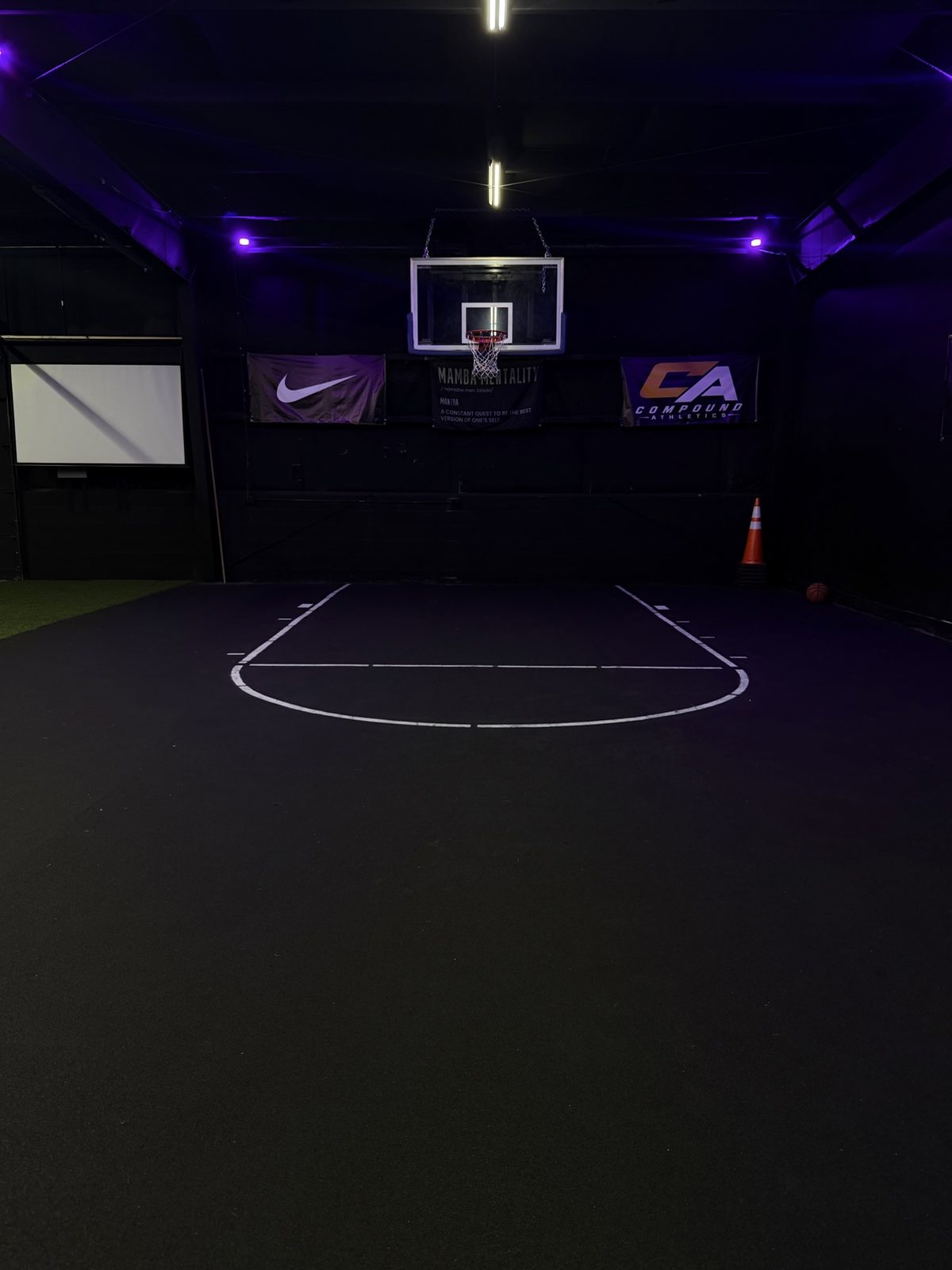 Basketball hoop over the Compound Athletics training court